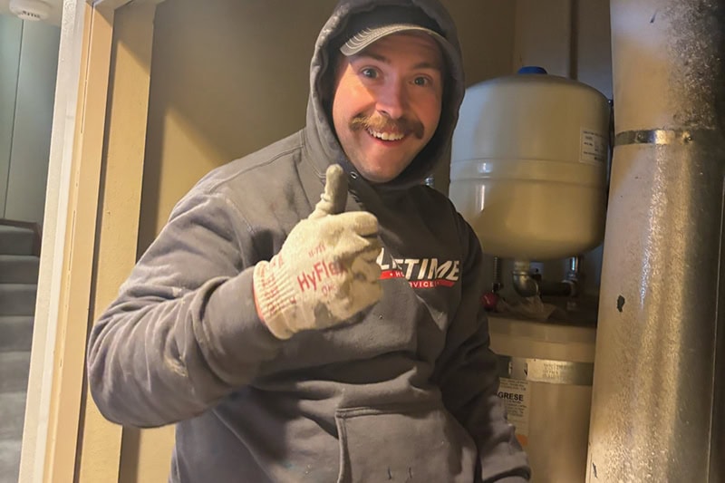 4 Reasons to Replace Your HVAC Air Filter. A man that just finished a job.