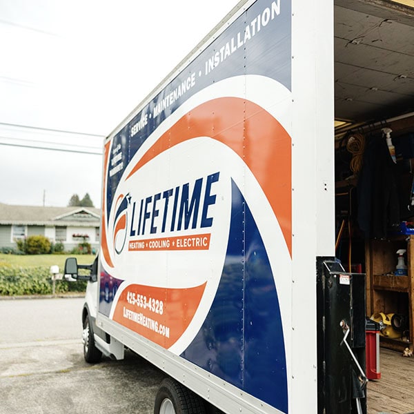 Lifetime Heating, Cooling, Plumbing & Electric logo on the side of company box truck.