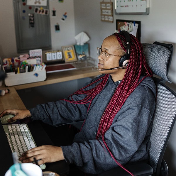Lifetime Heating, Cooling, Plumbing & Electric customer service representative working on computer.