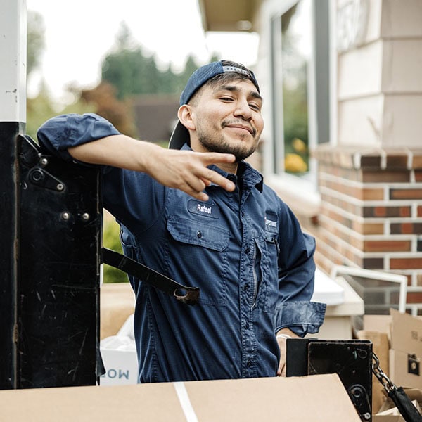 Lifetime Heating, Cooling, Plumbing & Electric technician smiling at camera.