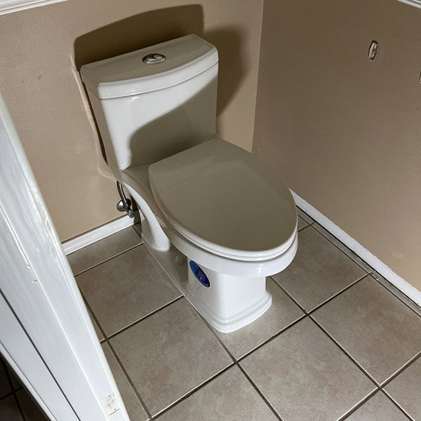 Small residential bathroom with toilet.